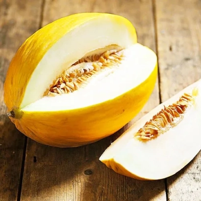 Sliced melon on wooden surface - Olivia