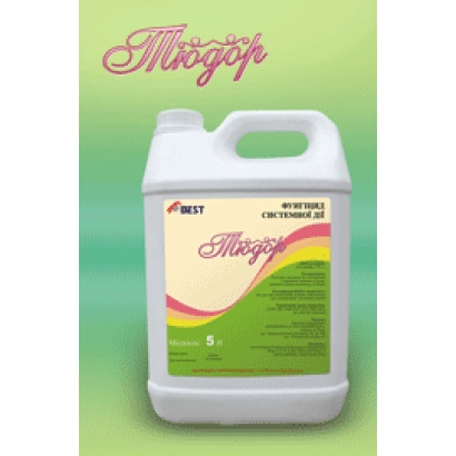 Bottle of fungicide Tudor with label on green background