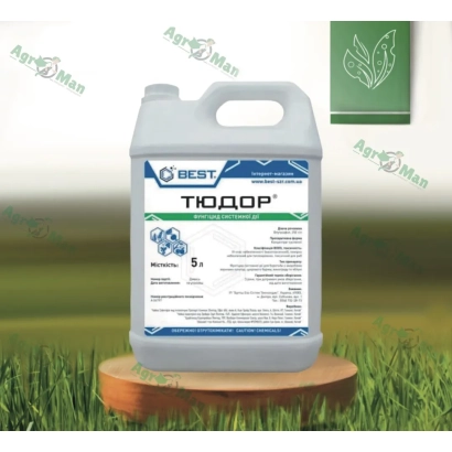 Fungicide Tudor in a white jug on a wooden stand against a green grass background - Tudor c.s.
