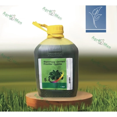 Bottle of herbicide Front on wooden stand against grass background