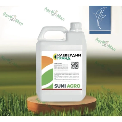 Canister of herbicide Cloverdim Grand on grass background
