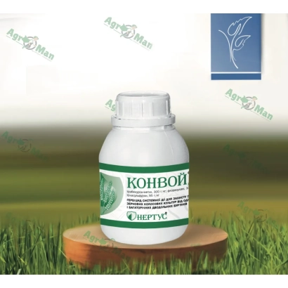 Бутелька гербициду Конвой на дерев'яній підставці на фоні трави