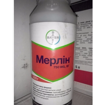 Bottle of herbicide Merlin 750 WG with label on white background