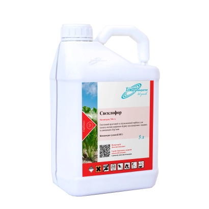 Біла канистра з етикеткою Свеклофор на фоні зеленого поля - Бурякофор