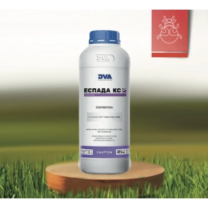 Bottle of insecticide Espada KS on a wooden stand against a grass background