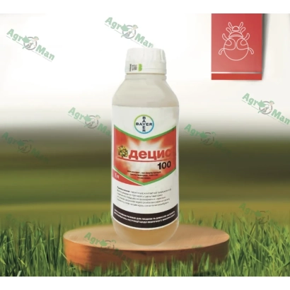 Bottle of insecticide Adecid 100 on a wooden stand against a grass background - Shaman KE