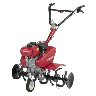 Мотоблок Honda FE500 E1 — красный культиватор с черными лопастями и рукояткой управления.