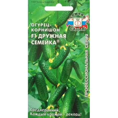 Пакет семян огурца «Дружная Семейка» с изображением зеленых огурцов на фоне листьев.