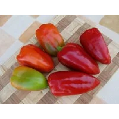 Red and green peppers of the Sandra variety on a wooden board