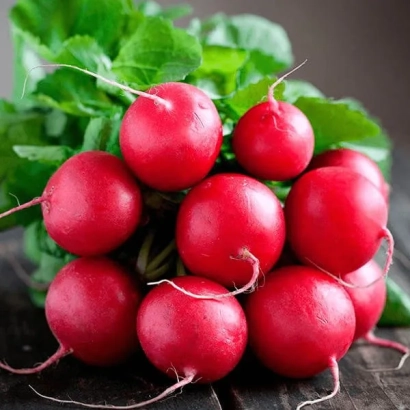 Fresh radishes on a wooden surface - Prometei
