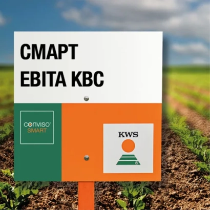 Sign with product name SMART EVITA KWS in front of sugar beet field