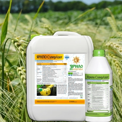 Bottle of fertilizer YARILYO Complex against a wheat field background - Liquid Fertilizers «KOROL», r., fertilizer