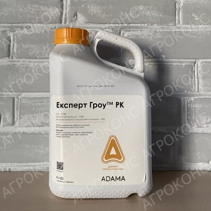 Белая канистра с надписью Експерт Гроу™ PK на фоне кирпичной стены