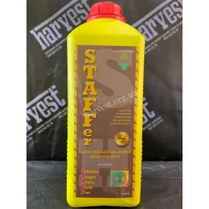 Желтая бутылка удобрения STAFFer с красной крышкой на темном фоне - STAFFer (СТАФФер)
