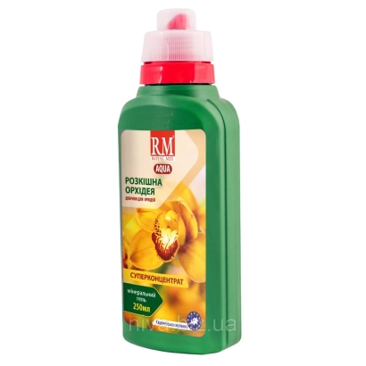 Зеленая бутылка с розовым колпачком и этикеткой 'Розовая орхидея' на фоне желтых цветов. - UMiD aqua mix