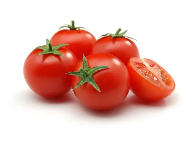 Ripe red tomatoes of the Ramses F1 variety on a white background